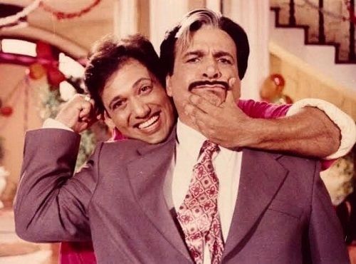 Govinda with Kader Khan in one of their films
