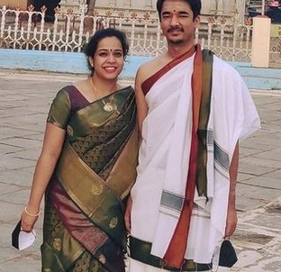 His son Ambi with his wife