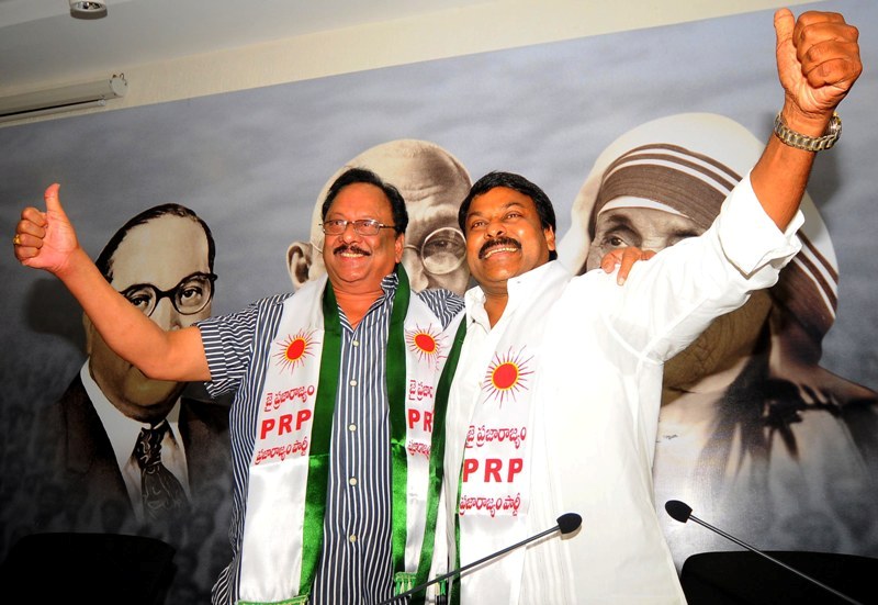Krishnam Raju posing with PRP chief Chiranjeevi after joining the Praja Rajyam in Hyderabad in 2009
