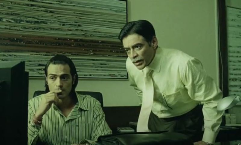 Micky Makhija as Mr.Joshi in a still from the film Don (2006) alongside actor Arjun Rampal