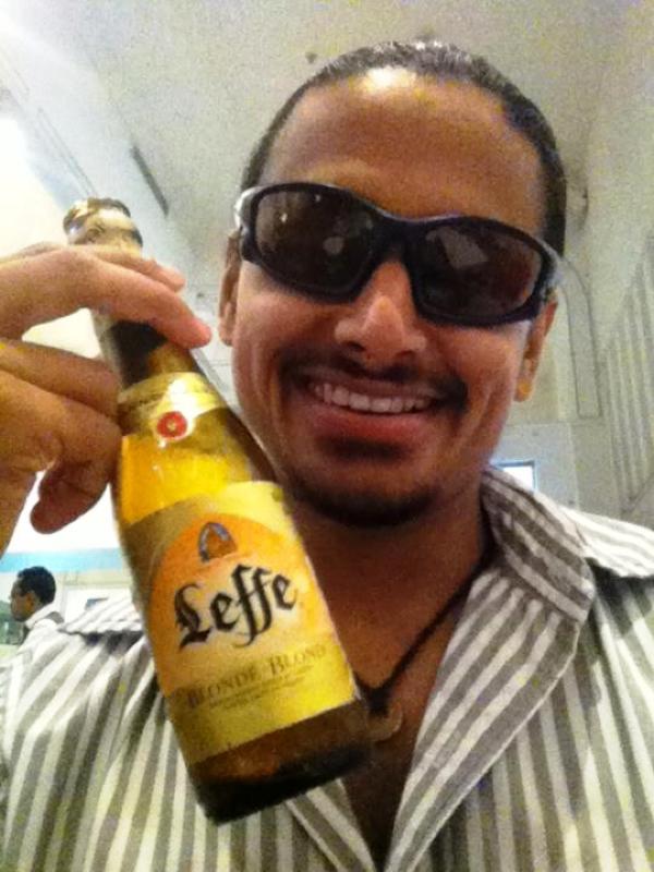 Nupur Shikhare holding a beer bottle