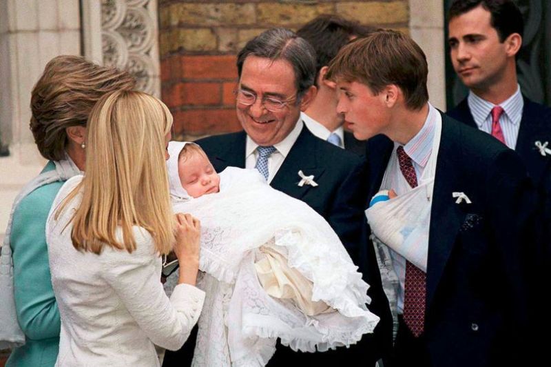 Prince William with his godchild, Konstantine Alexios Of Greece held by King Constantine Of Greece at the Greek Cathedral of Saint Sophia in London