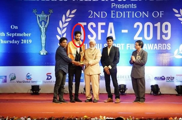 Raja Shekar holding the Telugu Short Film Award