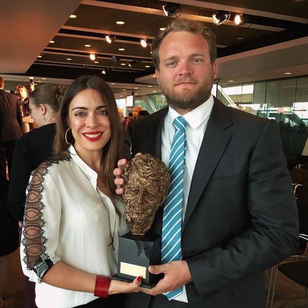 Ramita Navai, along with Patrick Wells, holding the Robert F. Kennedy Journalism Award for 'Iraq Uncovered'