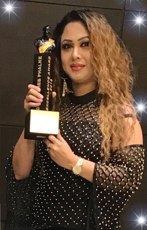 Rani Hazarika with the Dada Saheb Phalke Award after winning the title 'versatile singer' in 2018