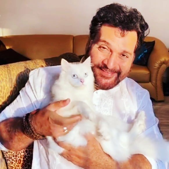 Shahbaz Khan with his pet cat Shanelle Khan