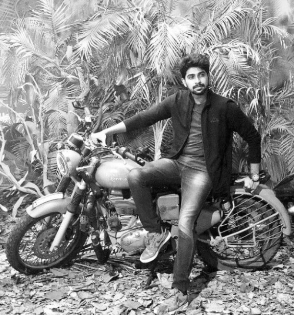 A photo of Kathirravan with his Royal Enfield