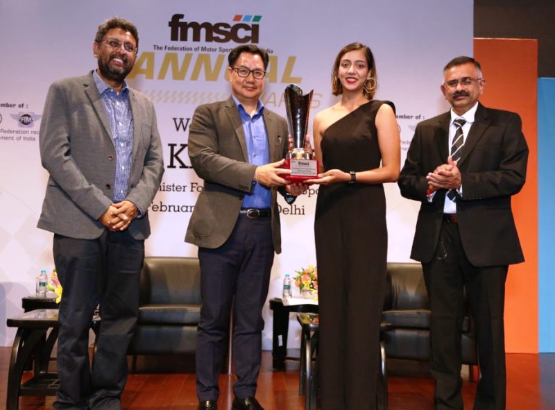 A picture of Aishwarya Pissay receiving FMSCI Outstanding Women in Motorsport Award (2019) from Kiren Rijiju, Minister of State (Independent Charge) for Youth Affairs and Sports