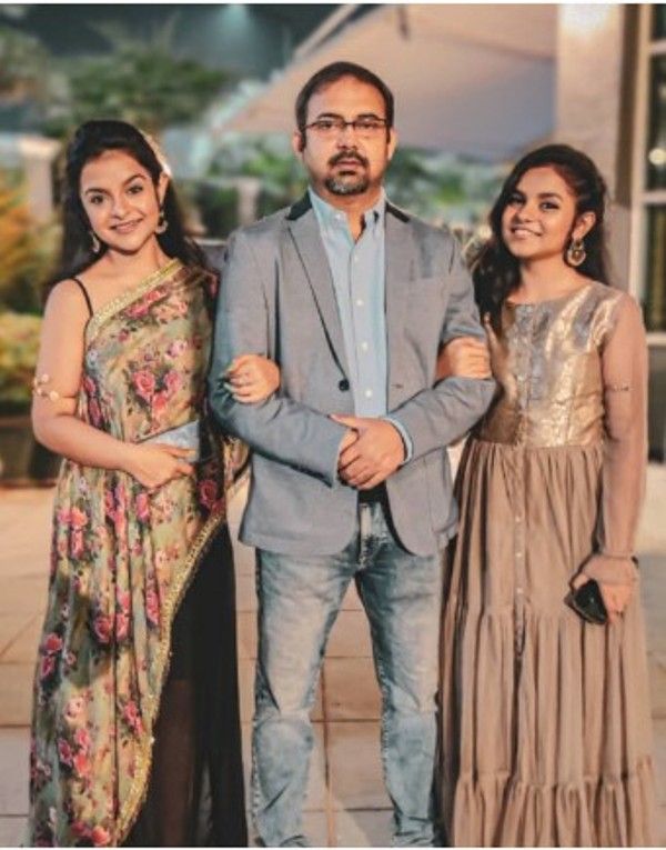 An image of Antara Nandy (left) with her sister Ankita (right) and father, Animesh