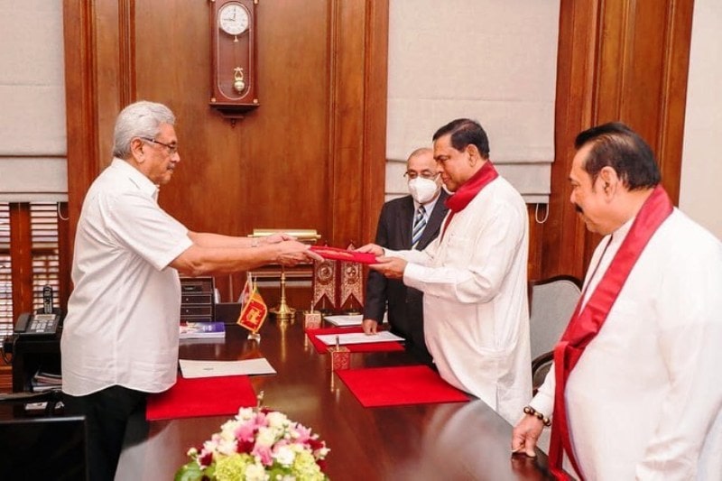Basil Rajapaksa handing over documents to Gotabaya Rajapaksa after swearing in as the Finance Minister