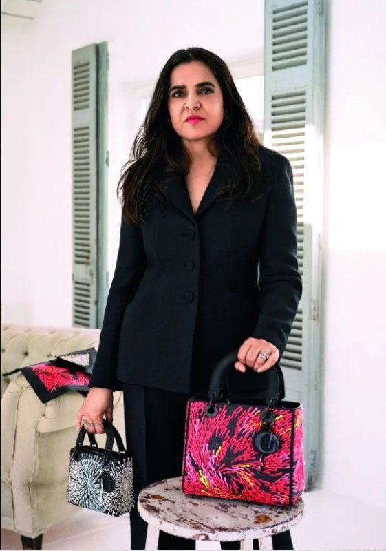 Bharti Kher holding Lady Dior bags designed by her