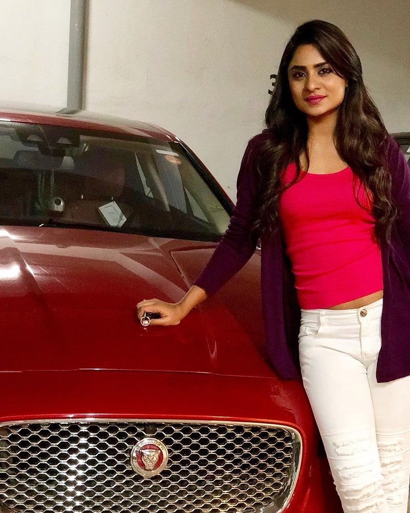 Deepika Das posing with her jaguar