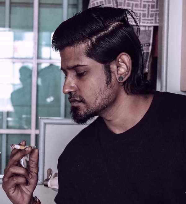 Dinesh Kanagaratnam while smoking