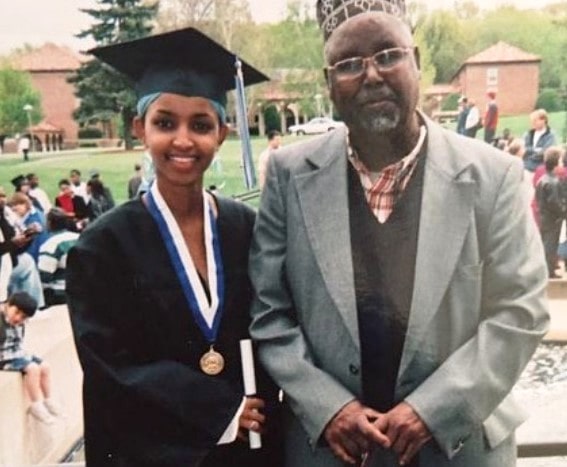 Ilhan Omar standing with her grandfather during her graduation ceremony