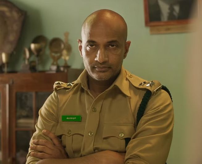 Kishore Kumar G in a still from the Kannada film Kantara