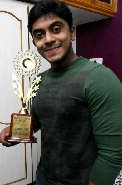 Mohammed Azeem posing with his Best Performer Award of the Year