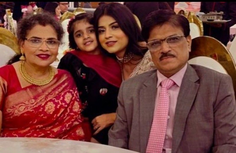 Nidhi Chaudhary's picture with her parents