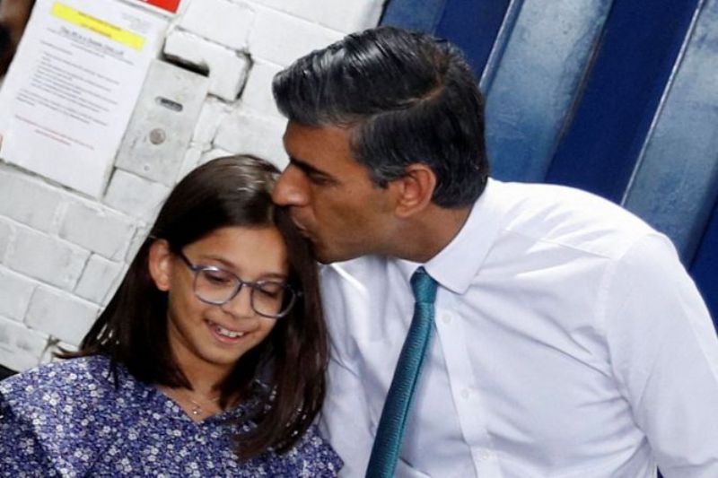 Rishi Sunak kissing his daughter Krishna Sunak - image captured at a party campaign event in Grantham, Britain, July 23, 2022