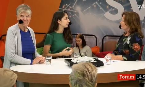 Romina Pourmokhtari discussing her party's policies during a news debate