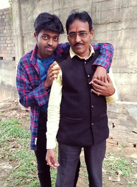 Adarsh Anand with his father