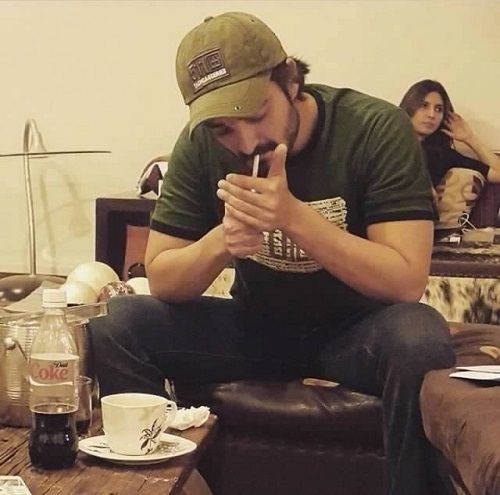 Hamza Ali Abbasi smoking a cigarette