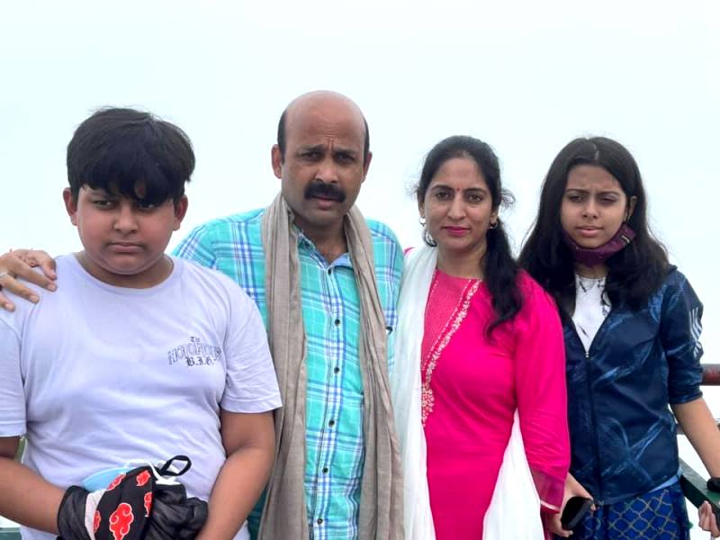 Harish Dwivedi with his wife and children