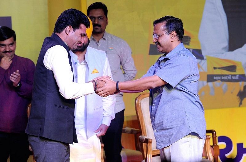 Isudan Gadhvi with Arvind Kejriwal after being elected as an AAP member