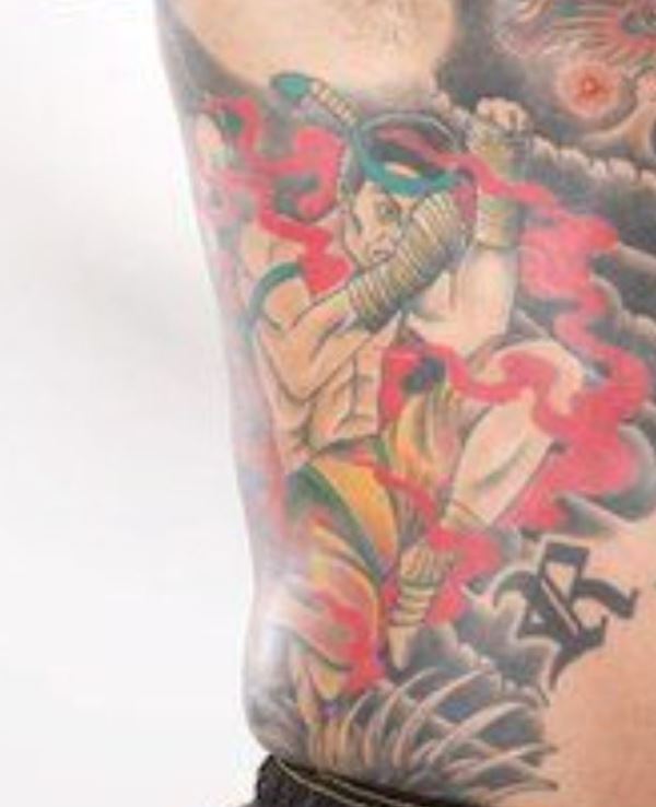 Jason David Frank's tattoo on right-side ribs