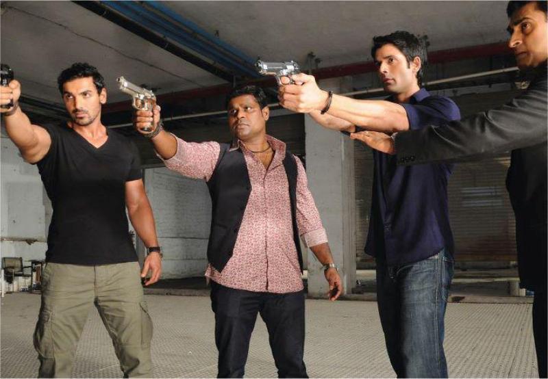 Kamlesh Sawant (second from left) in a still from the Hindi film Force (2011)