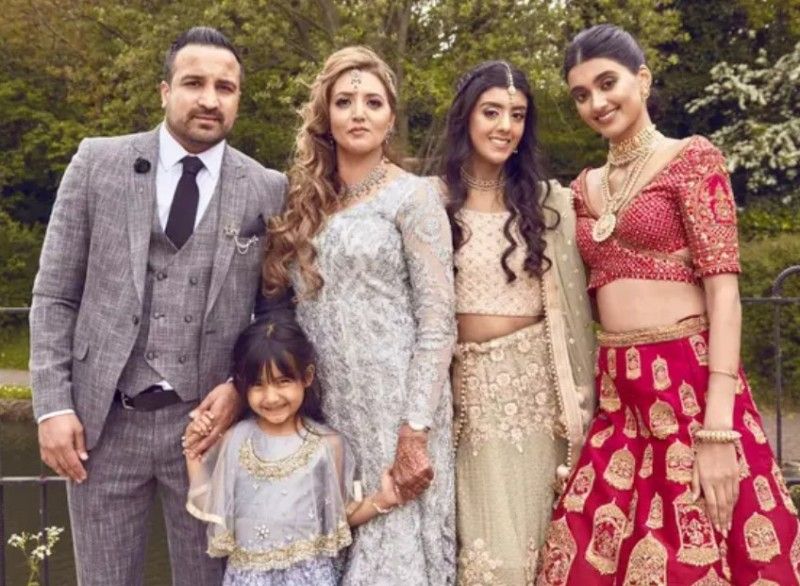 Neelam Gill (extreme right) with her stepfather (extreme left), mother (second from left), younger sister Jasmine (second from right) , and the youngest sister Millan