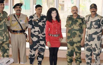 Palak Muchhal while posing with CRPF jawans after a charity show