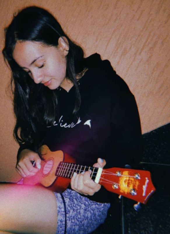 Pema Leilani playing the guitar