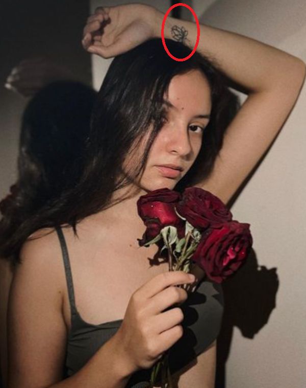 Pema Leilani's lotus tattoo on the wrist of her left hand