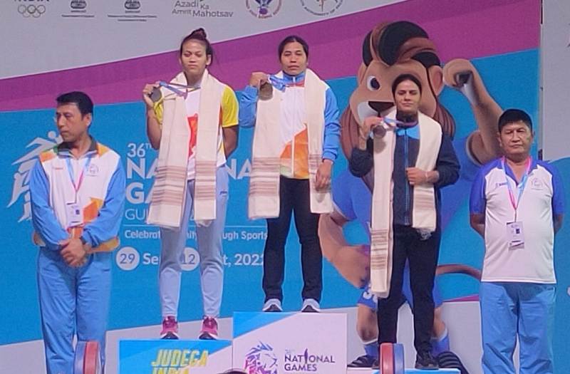Popy Hazarika (second from left) on the podium after winning silver in 36th National Games 2022
