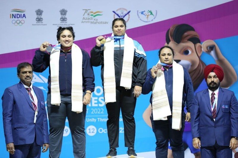 Purnima Pandey (center) on the podium after winning gold in the 36th National Games