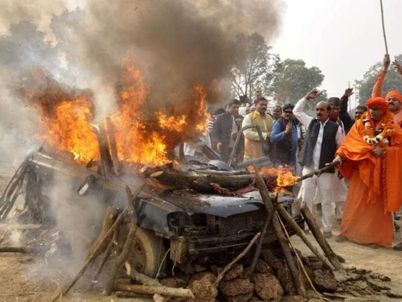 Right wing activist Chakrapani Maharaj, along with his followers, setting Dawood's car on flames at Indirapuram in Ghaziabad near Delhi 
