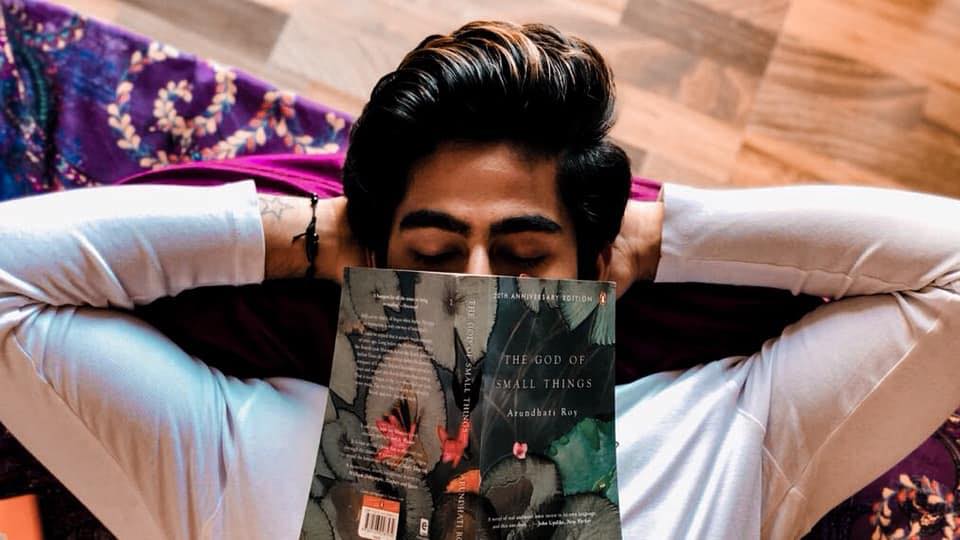 Rishabh Jaiswal posing with a novel