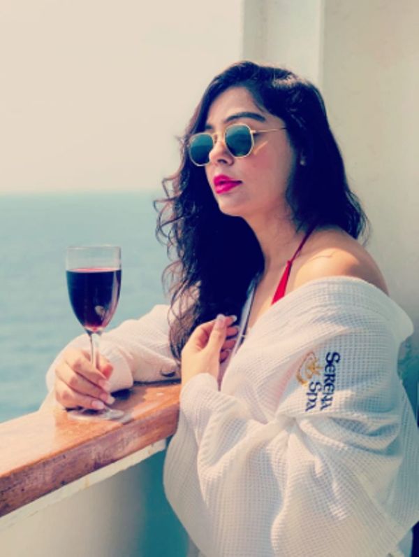 Saima Baloch drinking wine