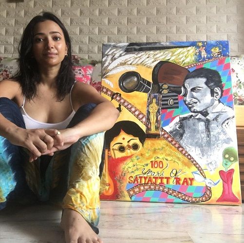 Shweta Basu Prasad sitting with a painting made by her