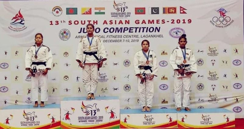 Suchika Tariyal (second from left) on the podium after winning gold in the 13 South Asian Games