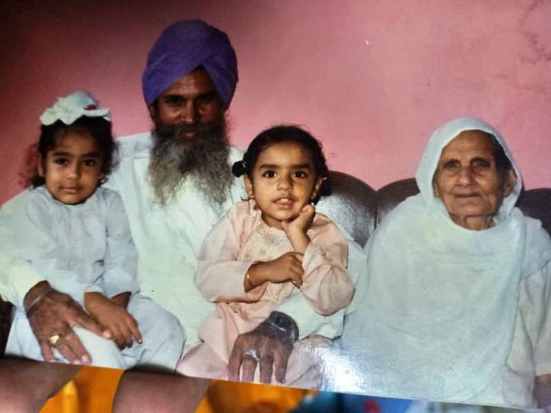 A childhood photo of Paramjeet Singh with his grandparents