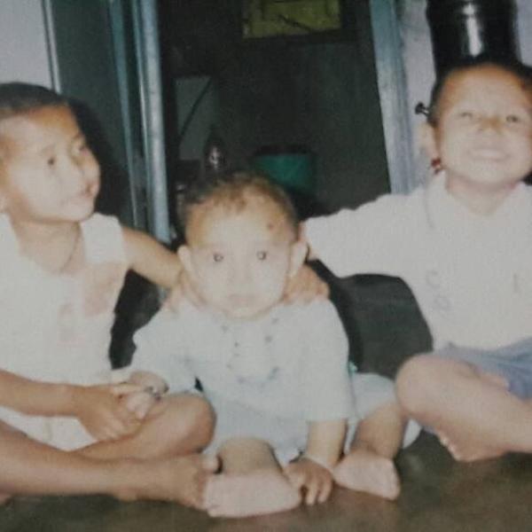 A childhood picture of Aakash Thapa (middle) with his sisters