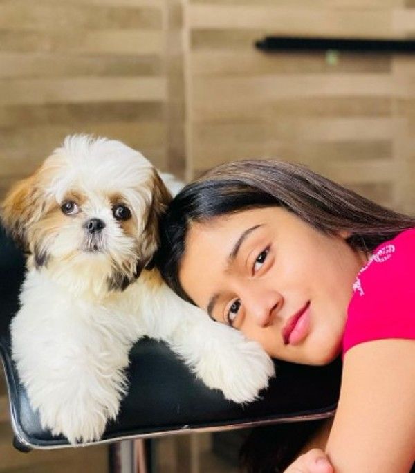 Aadhya and her pet dog, Sky