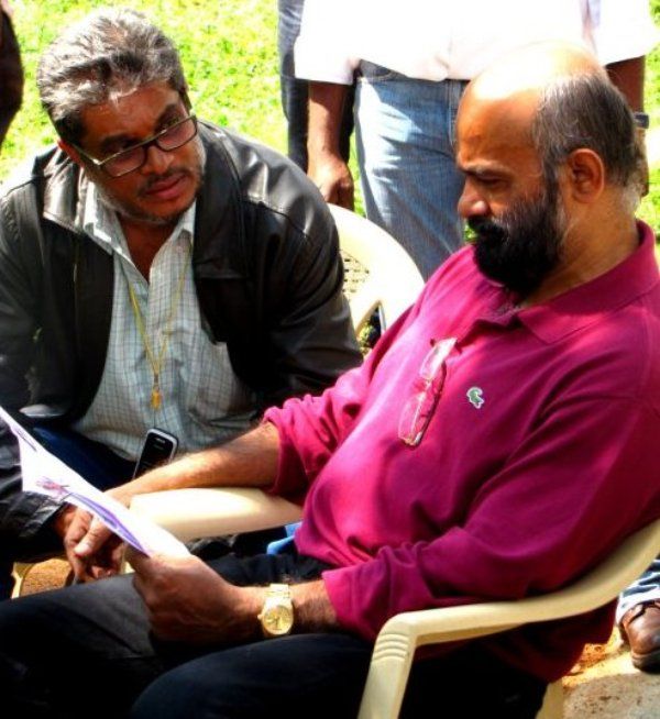 Agni Sreedhar (in red shirt) reading a script of the movie