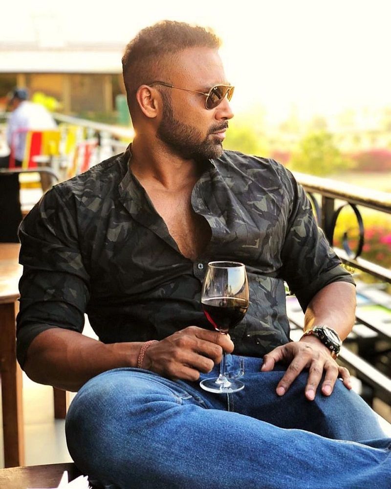 Apurva Padgaonkar holding a glass of wine