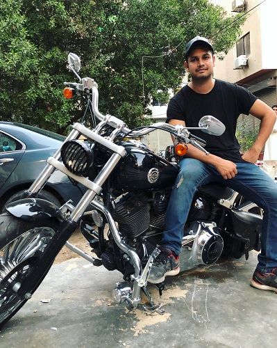 Azlan Shah sitting on his motorcycle