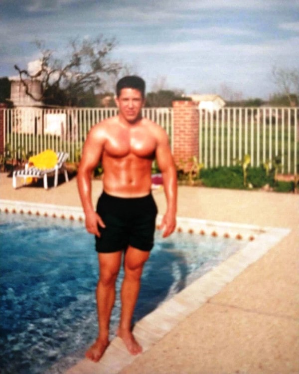 Brian standing near a pool