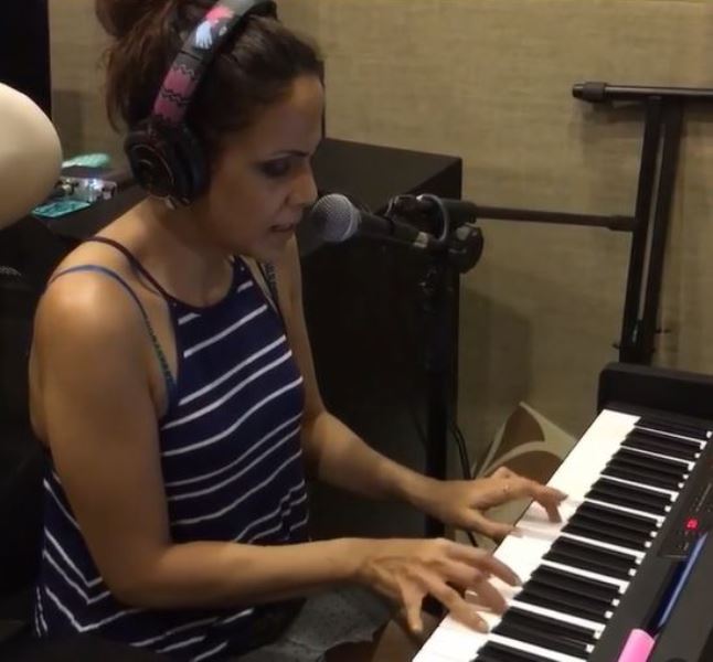Caralisa Monteiro playing synthesizer