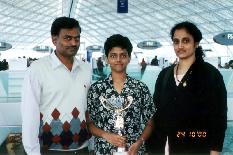 Harika Dronavalli with her parents at the age of 9 years
