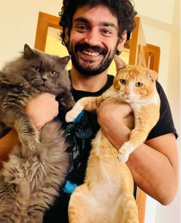 Kunj Anand and his pet cats, Bagheera and Mustafa